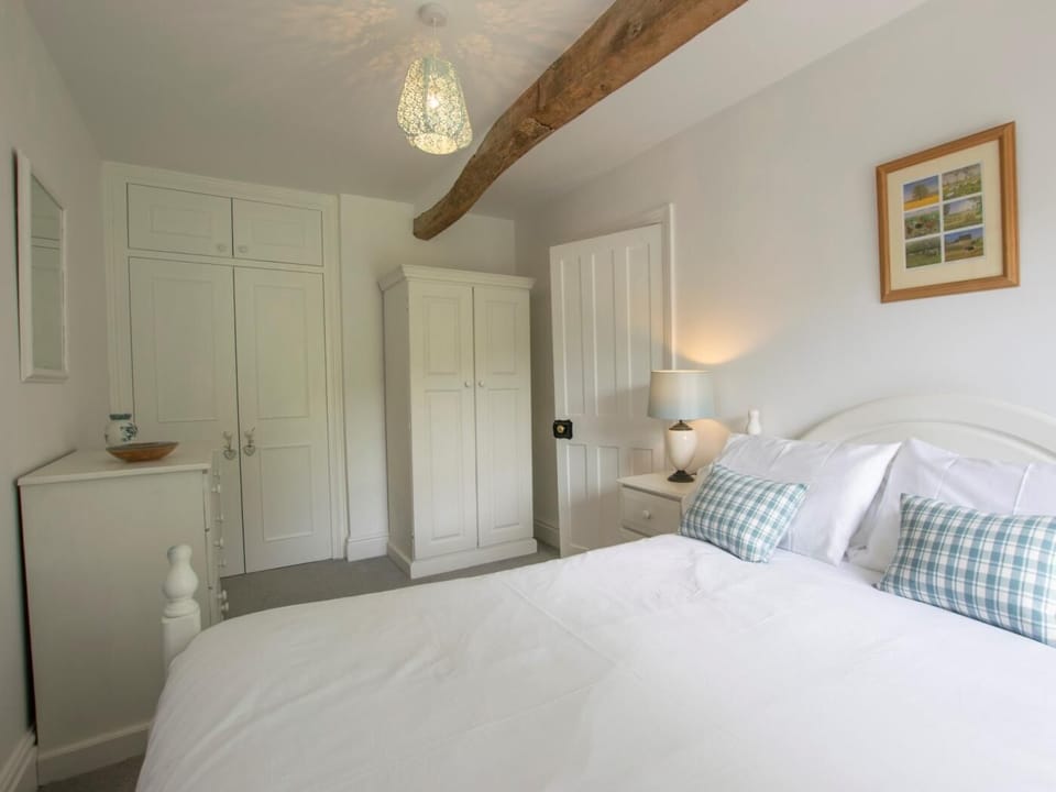 Master bedroom with beams and plenty of storage