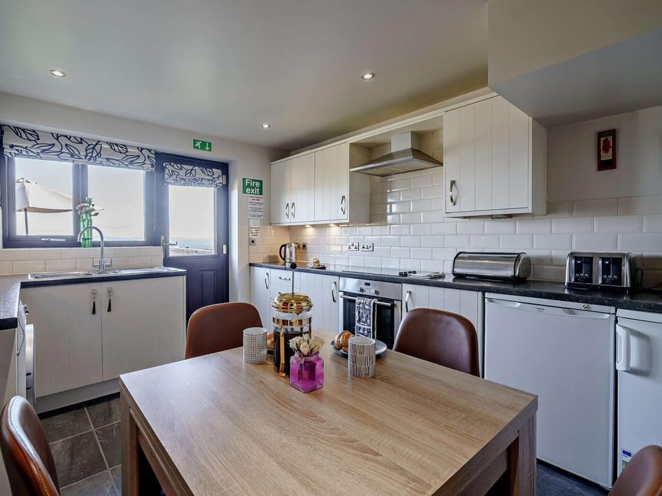 Modern kitchen with dining table