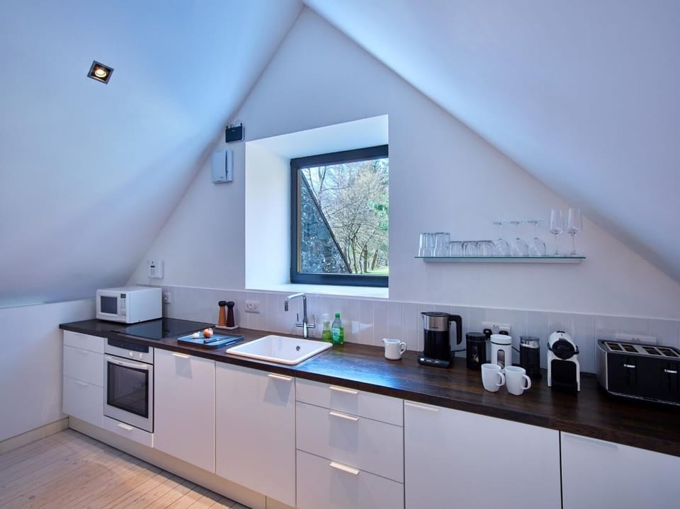 Prepare a meal in the well equipped kitchen area