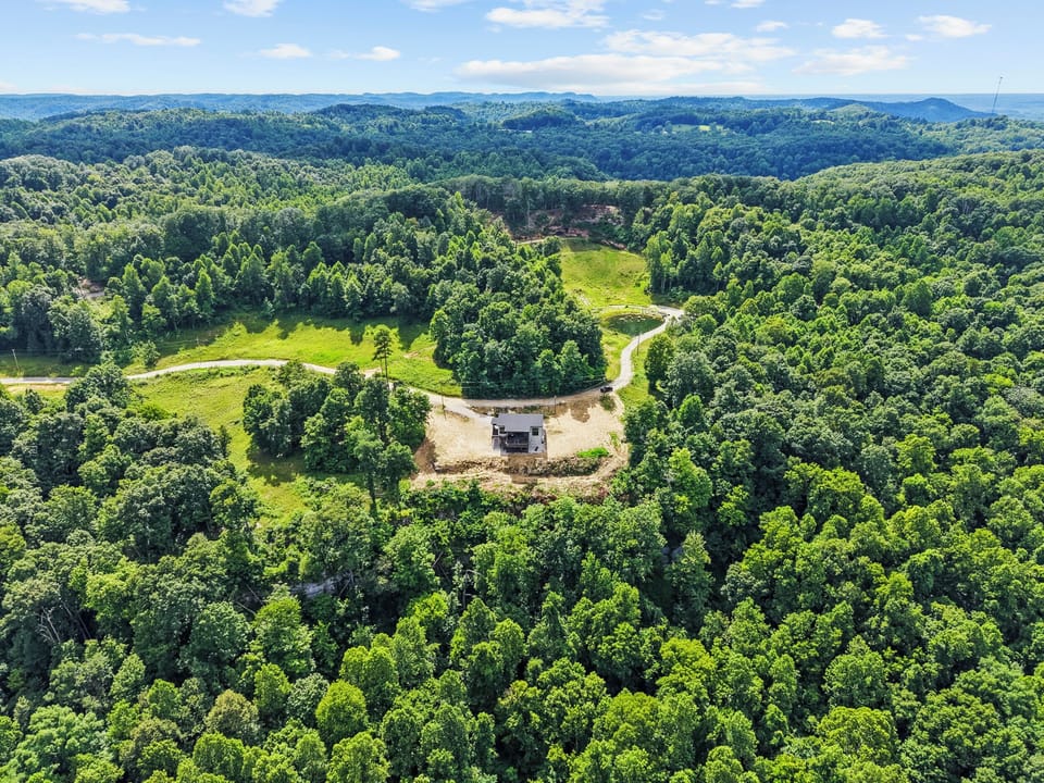 Private hilltop retreat surrounded by forest and scenic valley views
