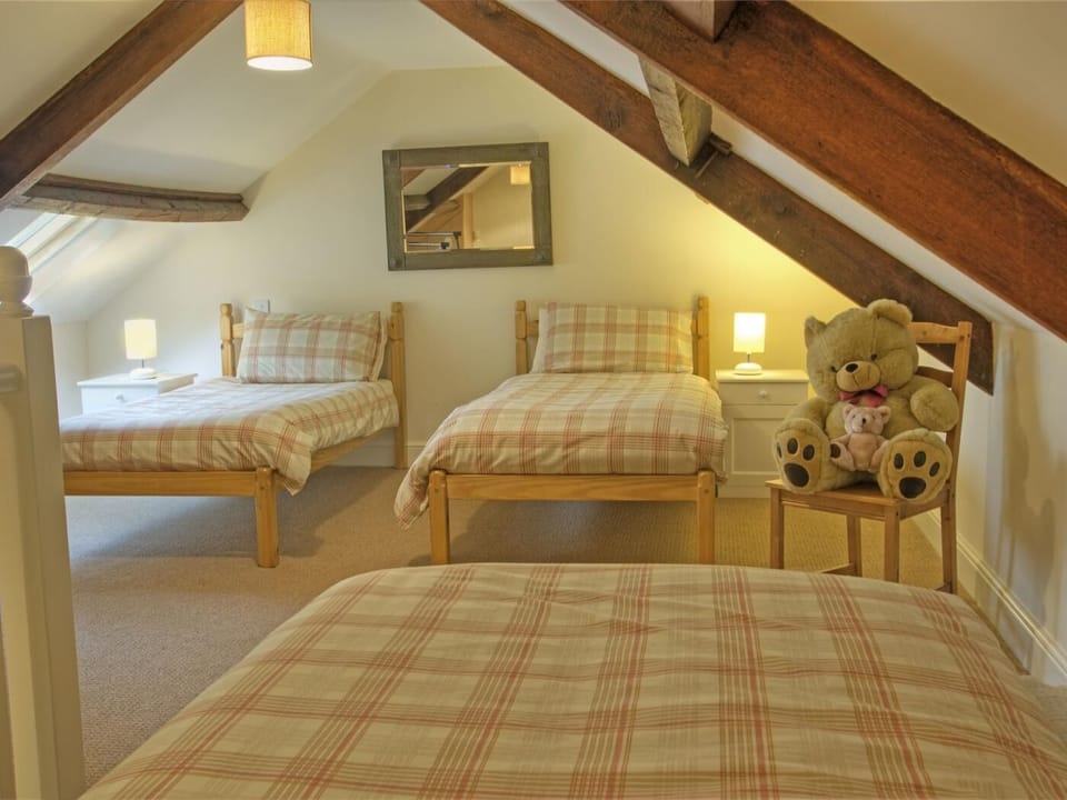 Upstairs there are three single beds