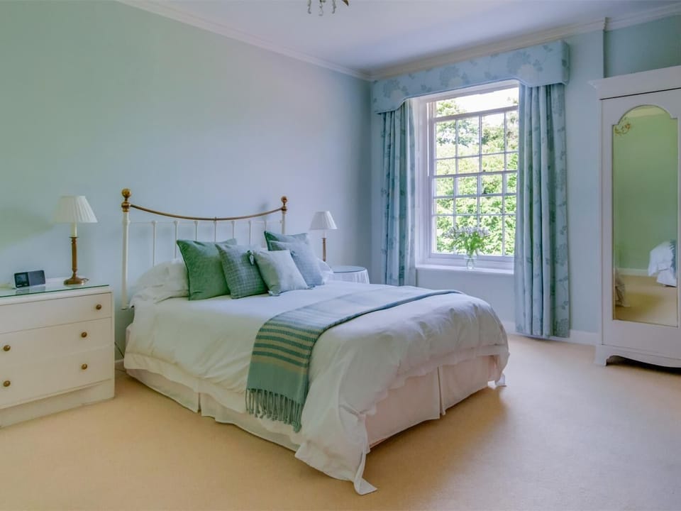 Spacious bedroom with a king sized bed and additional single bed on request 