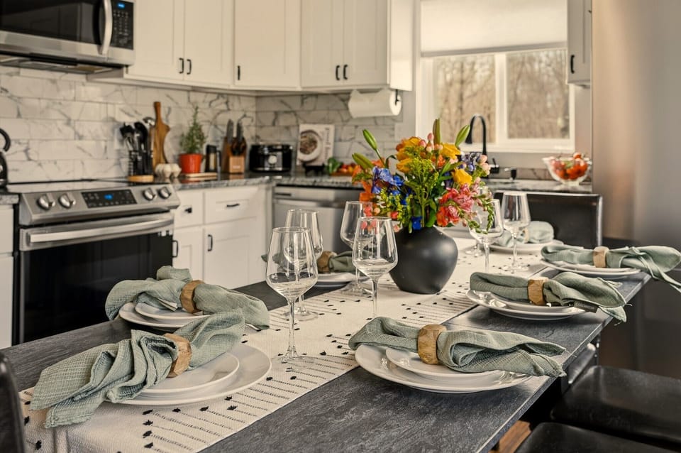 Stylish chef’s kitchen with elegant dining for six and natural light
