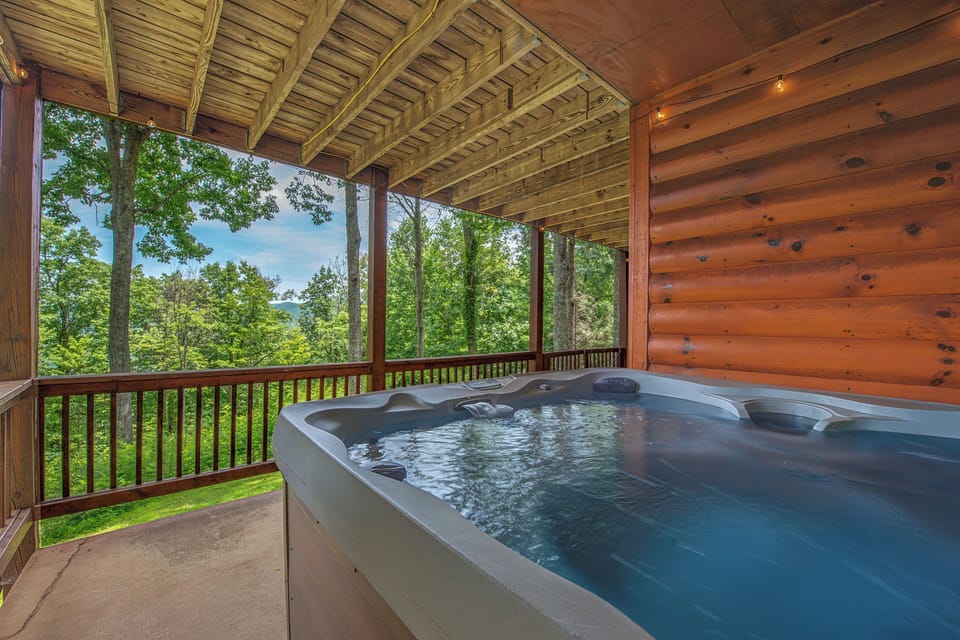 Slip into your private hot tub and let the mountain views and forest air melt your worries away—this is your place to unwind completely.