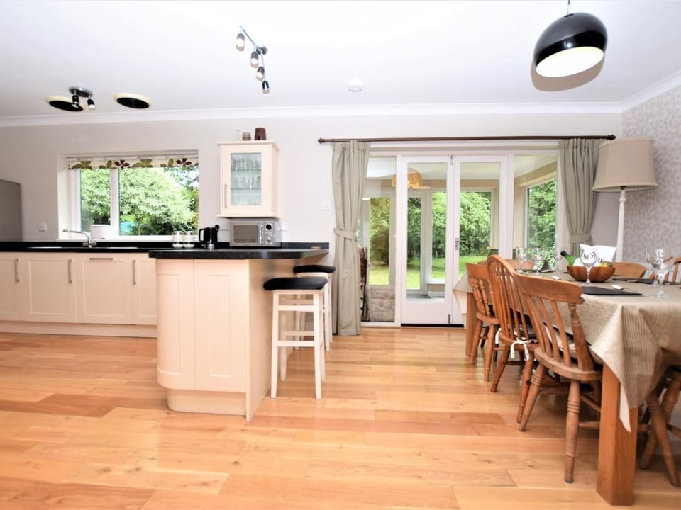 Spacious Kitchen/dining area leading to the sun room