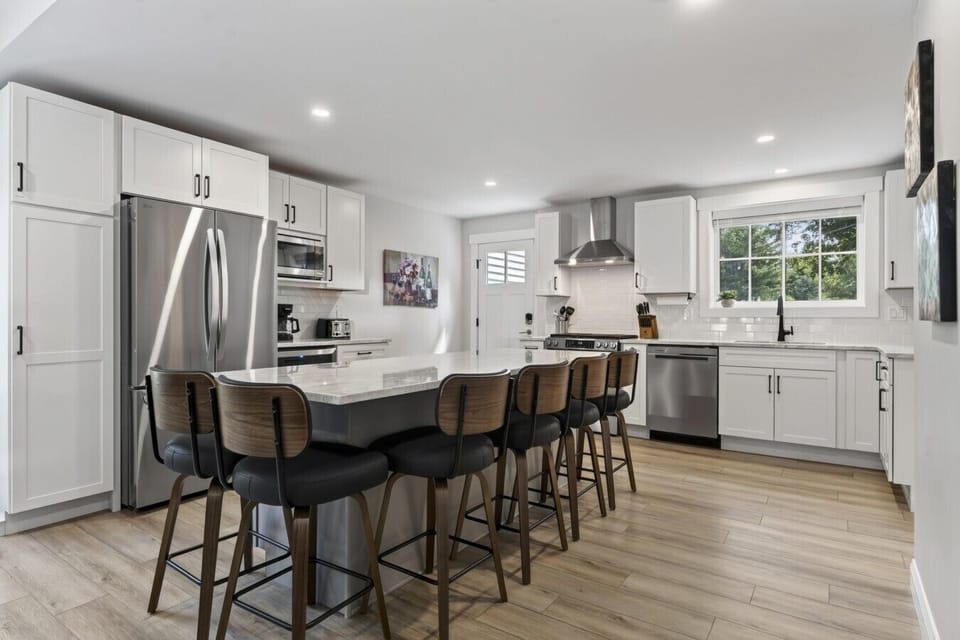 Big House: Kitchen Appliances include a gas range, microwave, Kuerig, Drip Coffee Maker, and a Beverage Fridge