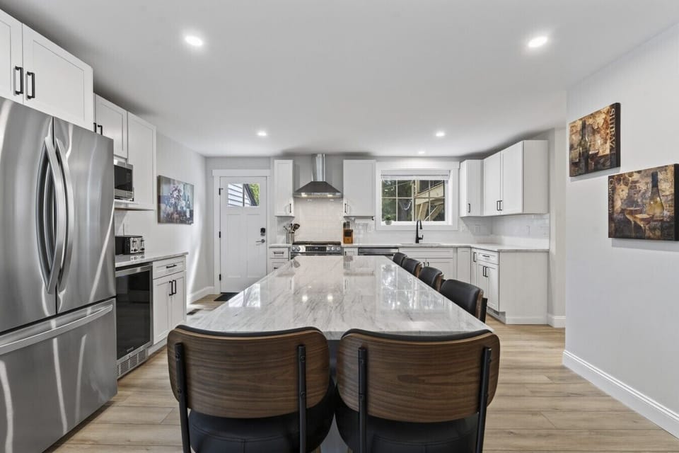 Big House: Large kitchen with premium quartzite countertops, coffee bar, and oversized kitchen island
