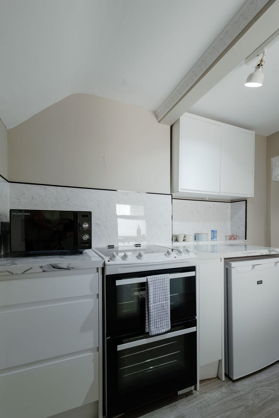 Fully equipped kitchen featuring a dishwasher, washer and dryer