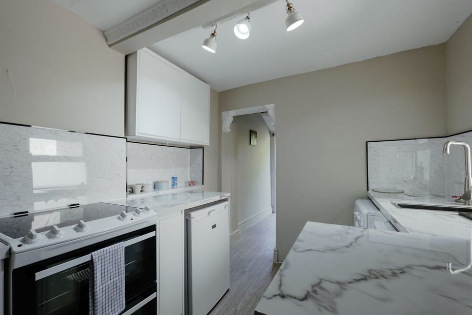 Fully equipped kitchen featuring a dishwasher, washer and dryer
