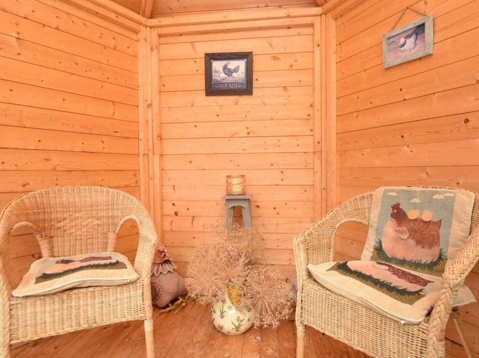 Step inside the summer house, the perfect place to relax with a morning coffee