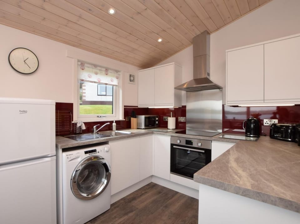 Prepare a meal in the stylish well-equipped kitchen