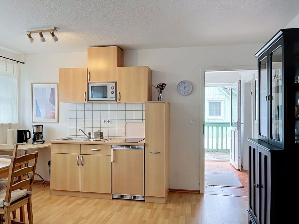 Furniture, Wood, Flooring, Interior Design, Kitchen, Floor, Room, Countertop, Cabinetry, Major Appliance