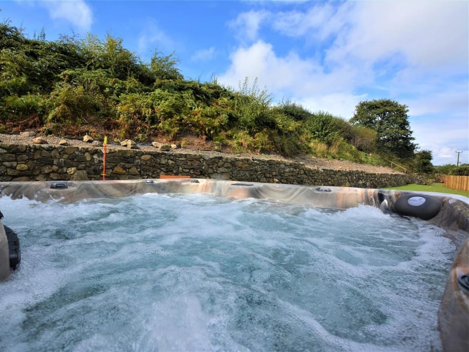 Enjoy the weather and relax in the hot tub
