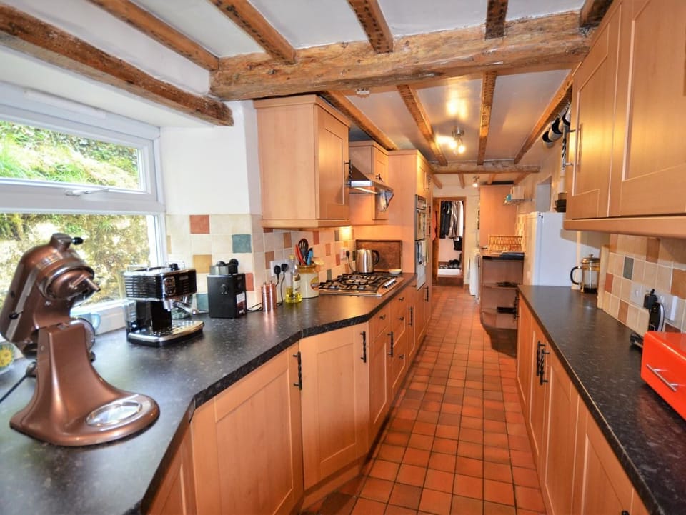 Fabulous galley kitchen with exposed beams