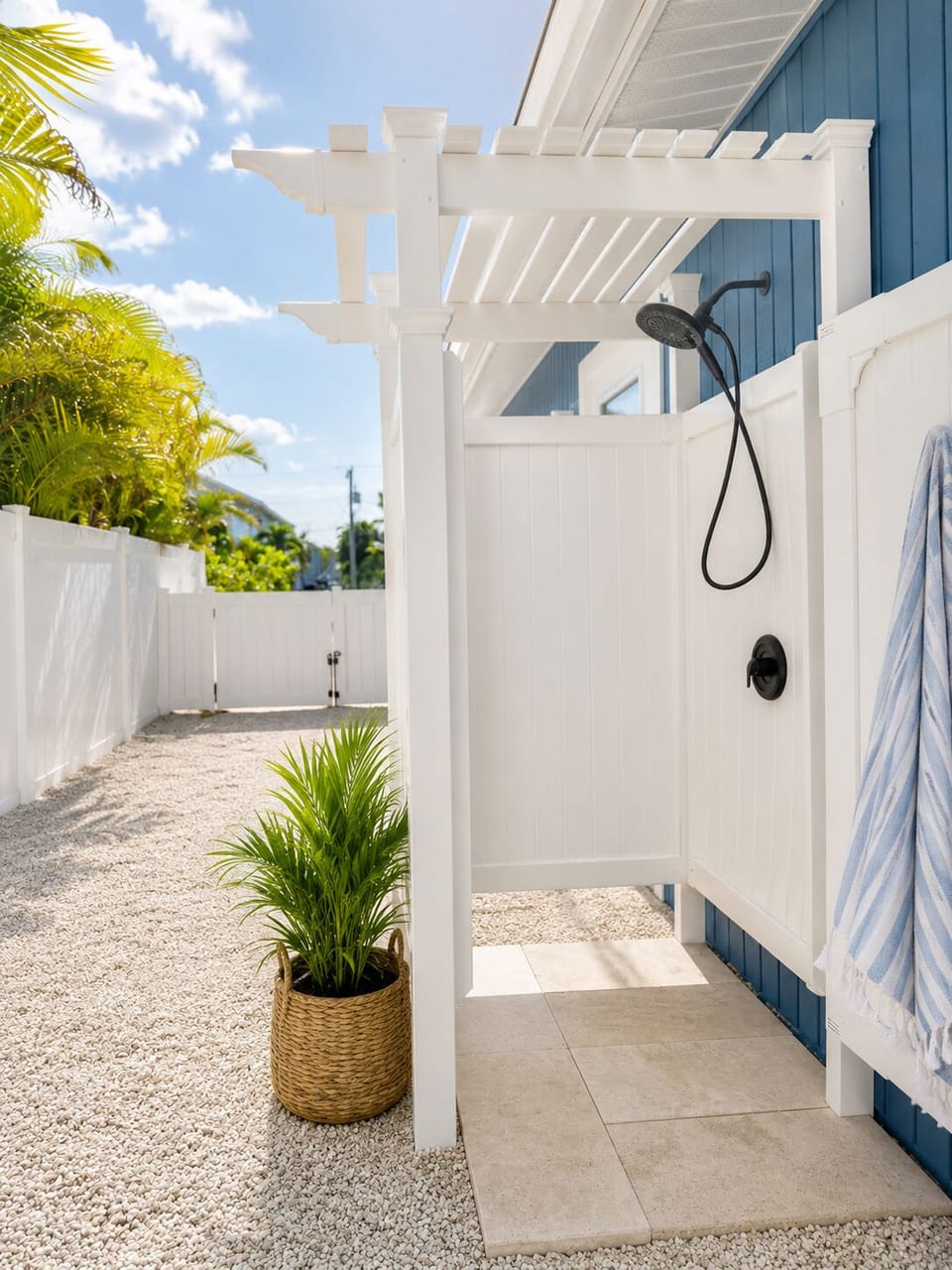 Private outdoor shower with tropical, resort-style coastal charm