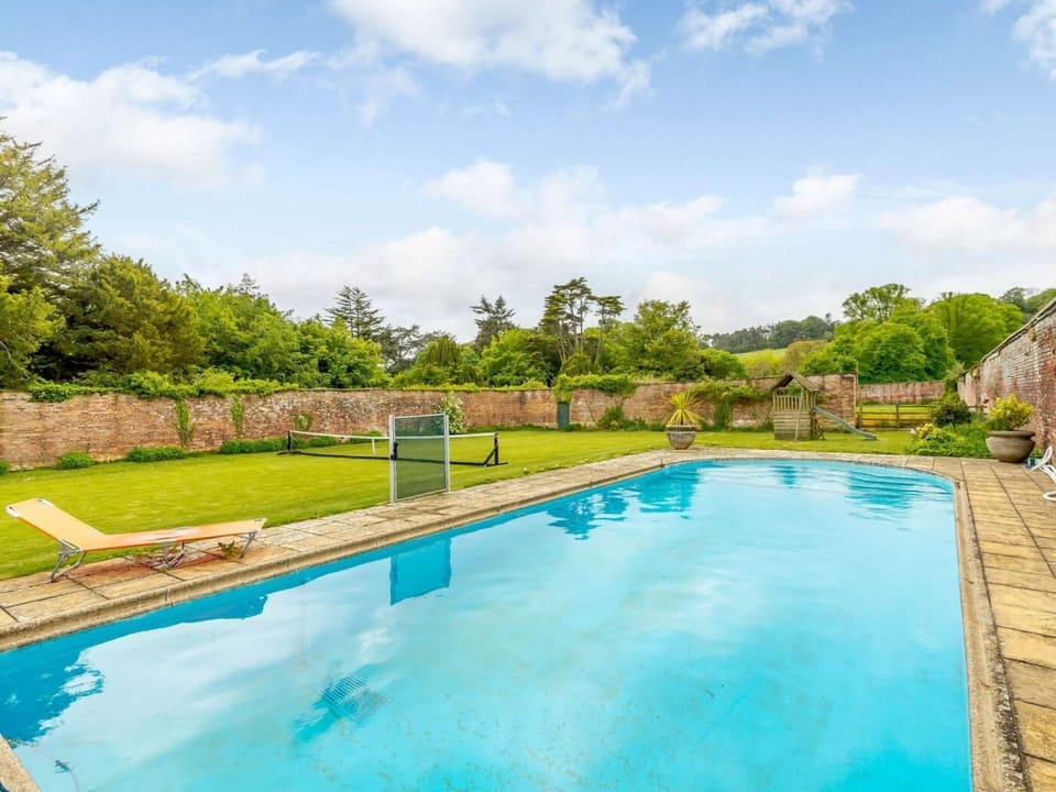 Shared heated outdoor pool and lawn tennis court within walking distance on Minterne Estate