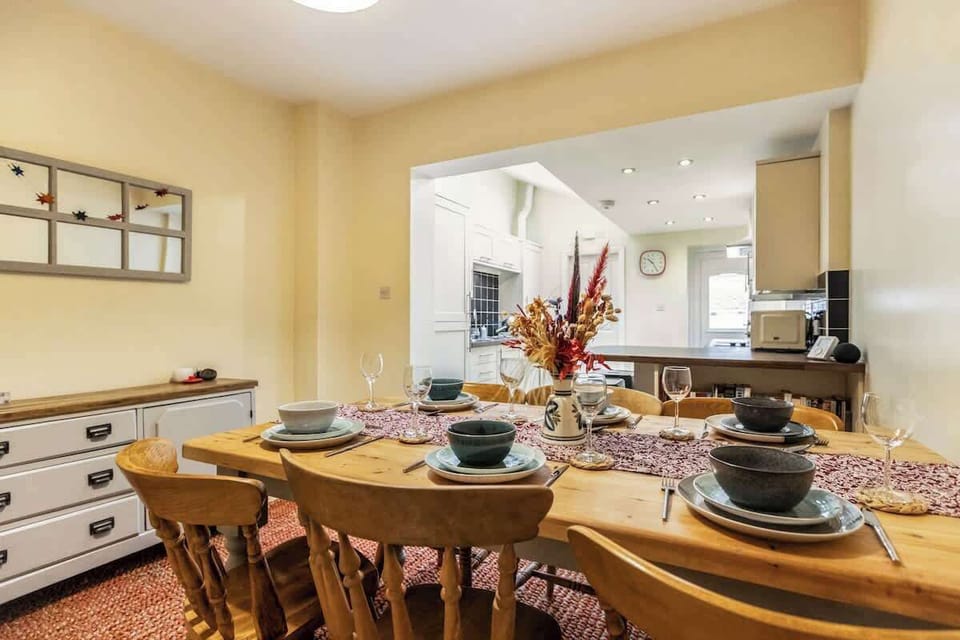 Spacious, open-plan kitchen-diner — perfect for socialising, cooking, and enjoying meals together. Features a large dining table, breakfast bar, and fully equipped kitchen.