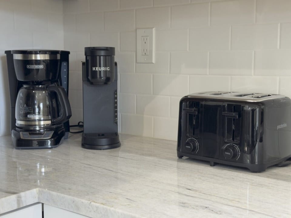 Carriage House: Brand new appliances including a drip coffee maker, Keurig, and Toaster