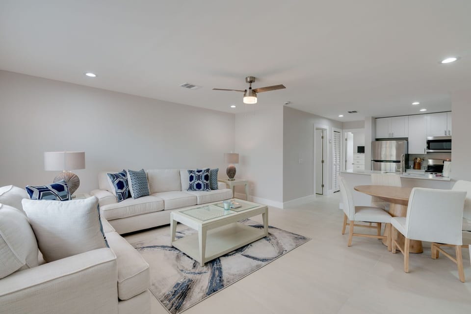 Oversized living room with sleeper sofa, flat screen smart tv, and dining table for four. 