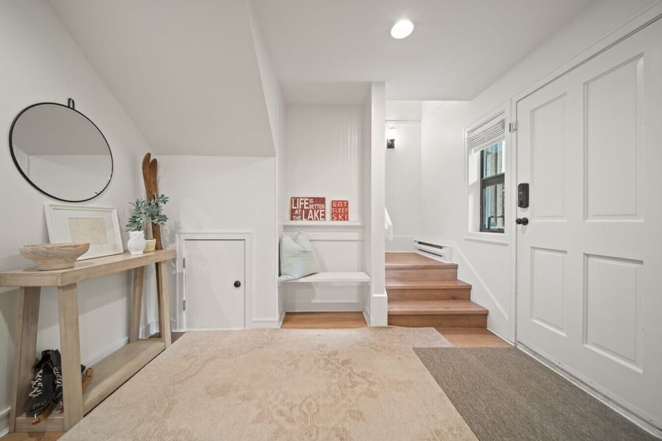 32.Entrance Bright, welcoming entry with bench seating and ski storage