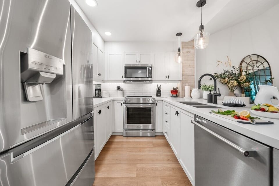 Fully equipped kitchen with stainless steel appliances and large island