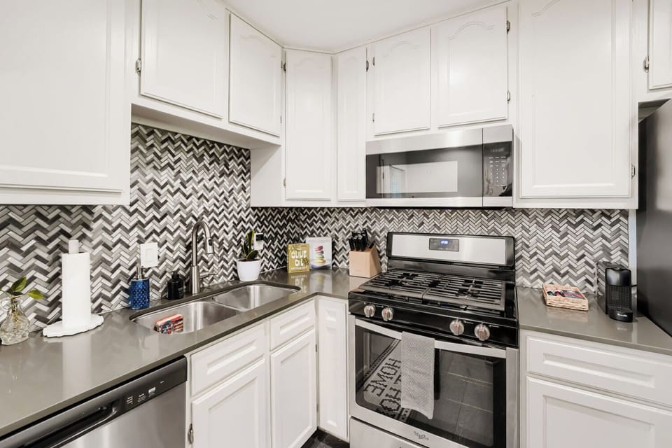 Fully equipped kitchen with gas range, microwave, and dishwasher