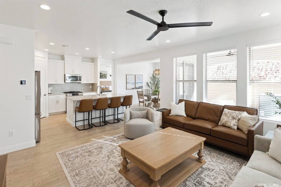 The kitchen opens directly into the living room, creating a welcoming space for cooking, socializing, and unwinding with family and friends.