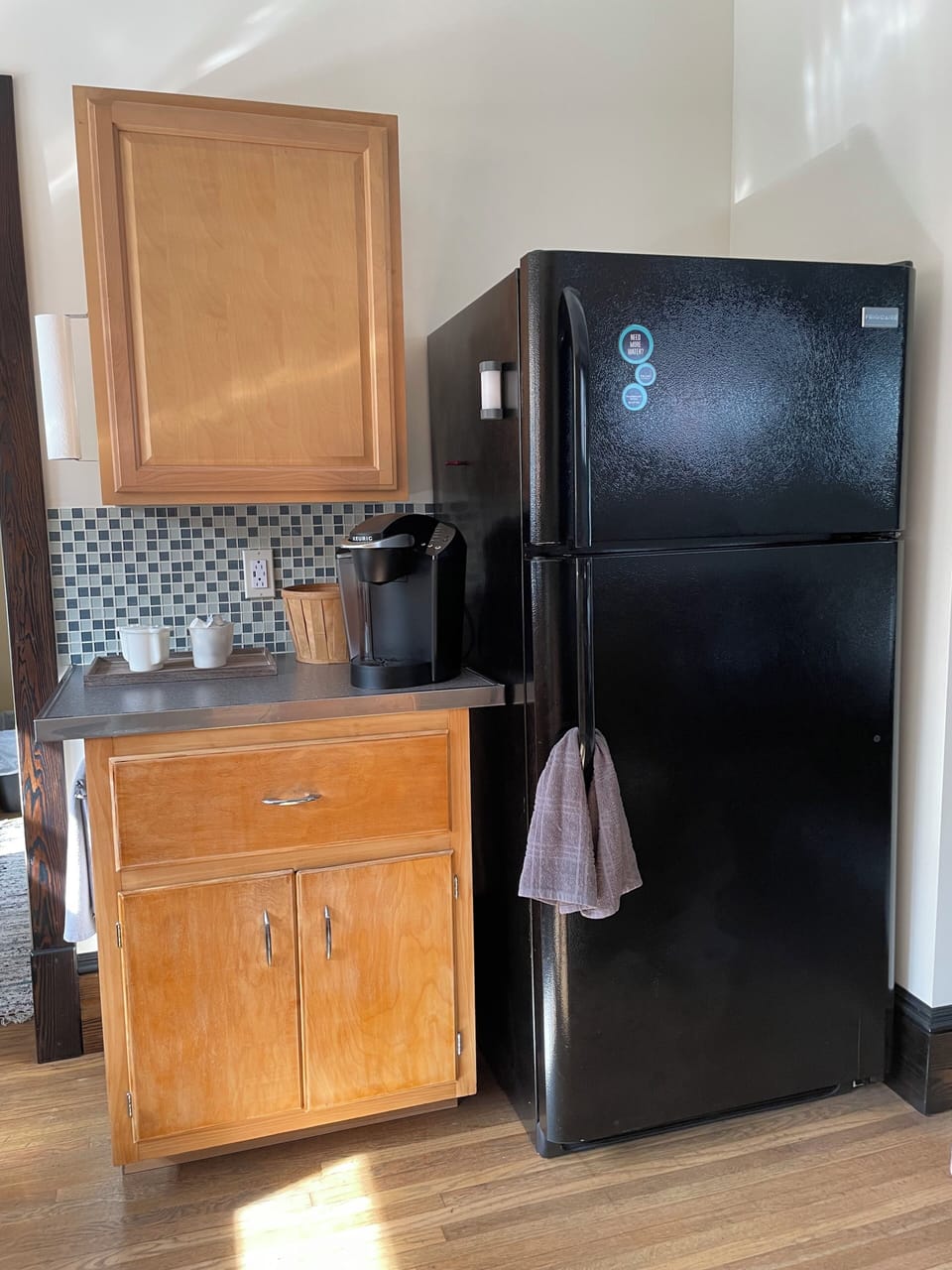 Kitchen refrigerator and coffee area.
