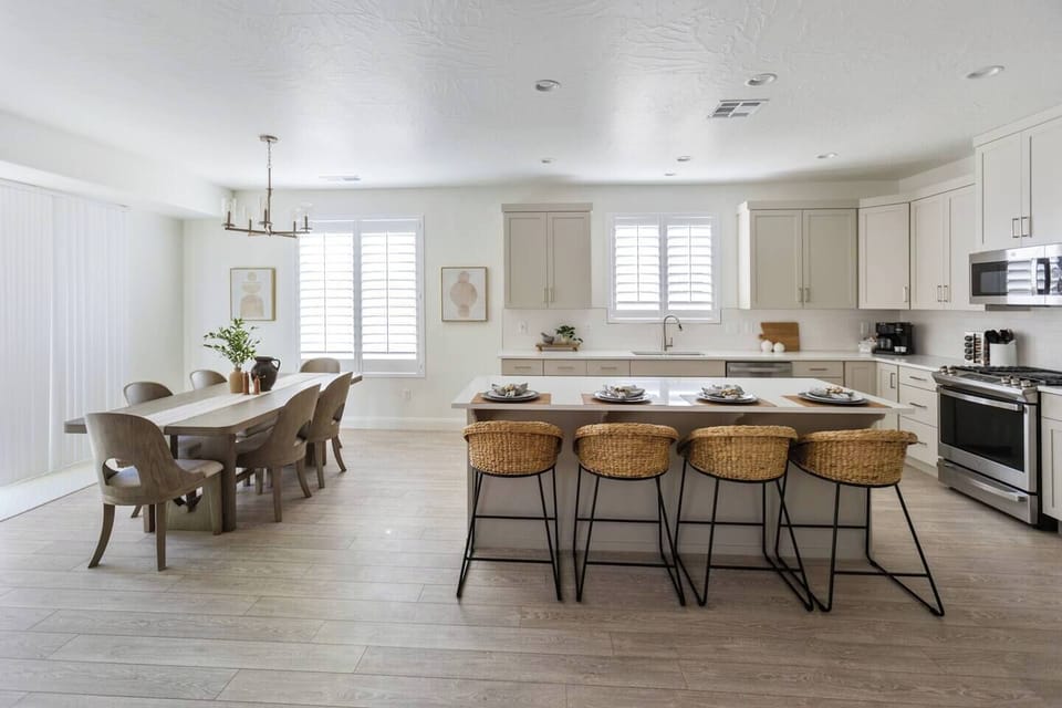 Spacious dining area with seating for six, and four additional spots at the bar—perfect for family dinners or a cozy breakfast.
