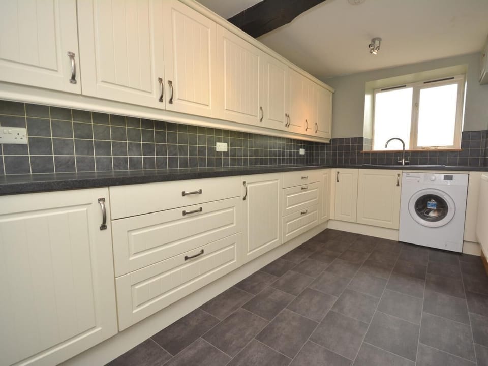 Handy utility room with washing machine