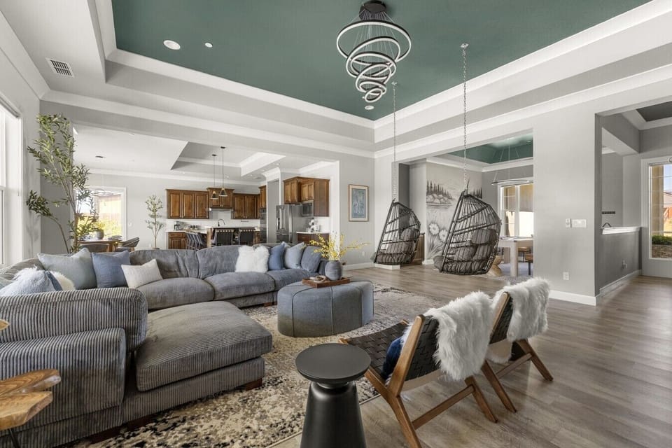 Relax beneath soaring ceilings and expansive windows that bring the outdoors in