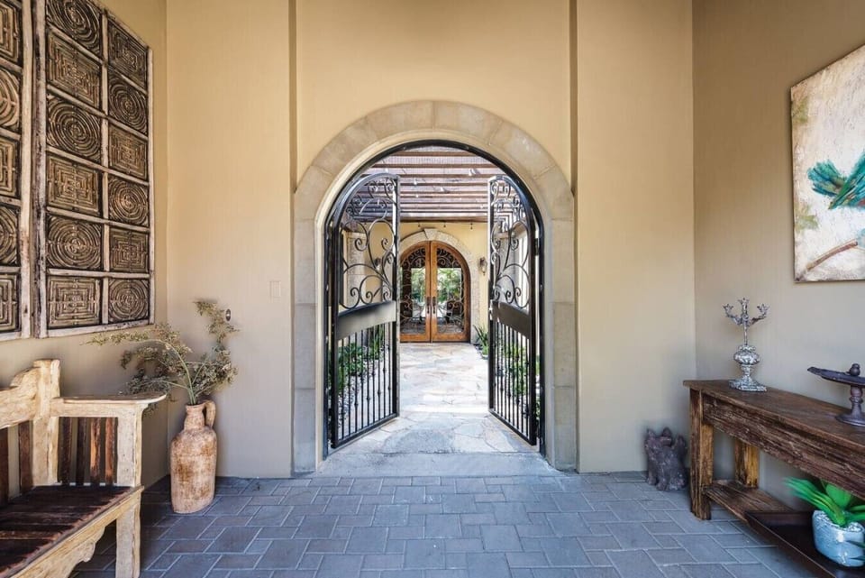 Impressive Stone Entry w/Wrought Iron Gates