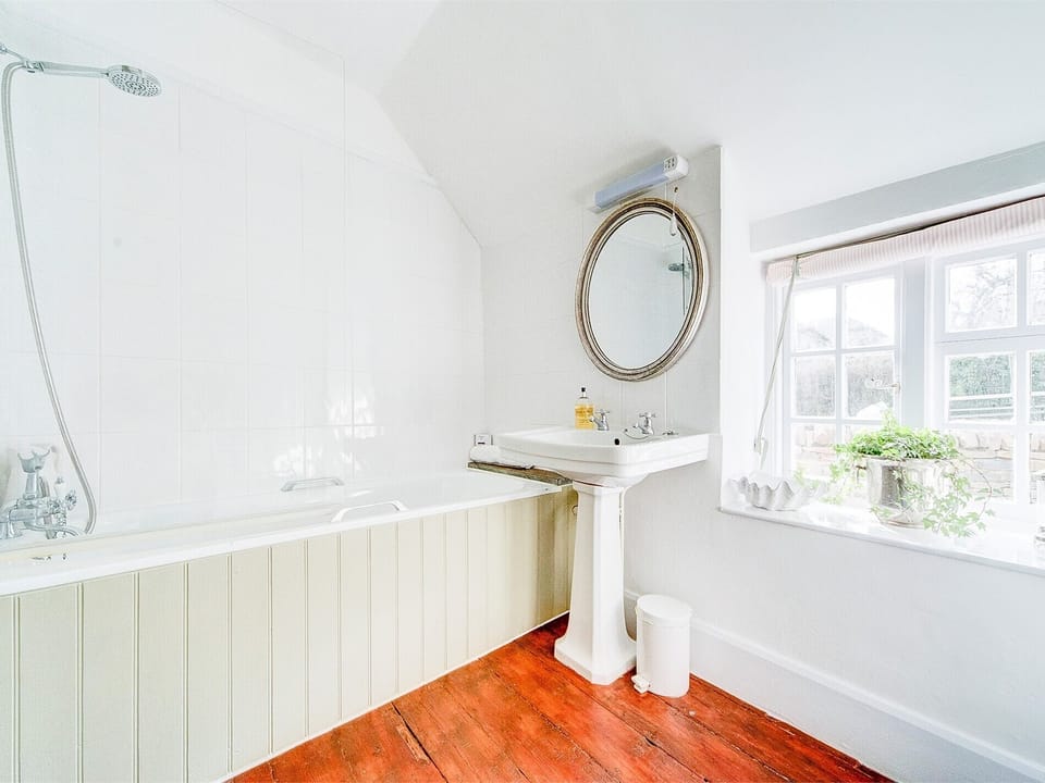 The bathroom offering shower over bath and WC 