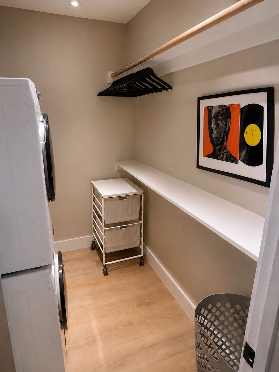 Oversized walk-in closet with plenty of storage space & full-size washer/dryer