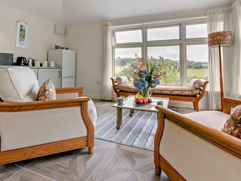 Luxury seating looking out over vineyard, or easily turned to view wall mounted, Smart TV