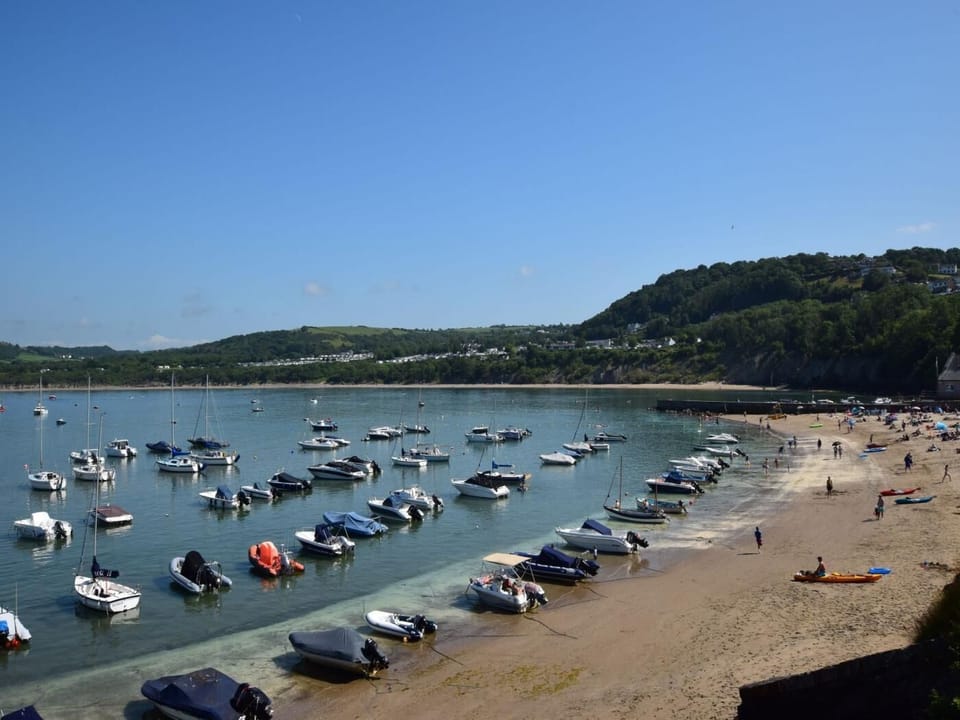 Enjoy a day on the bustling beach at New Quay