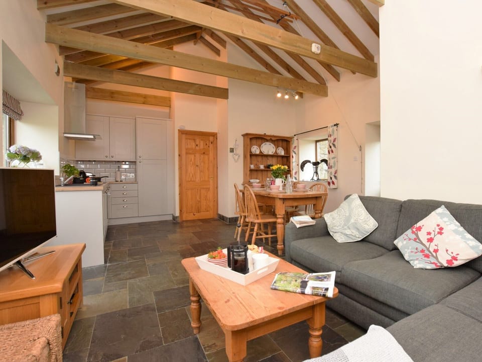 Light and open plan, with vaulted ceiling and exposed beams