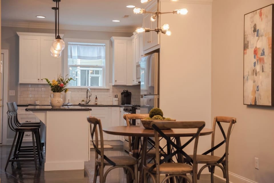 modern kitchen with dining table and bar