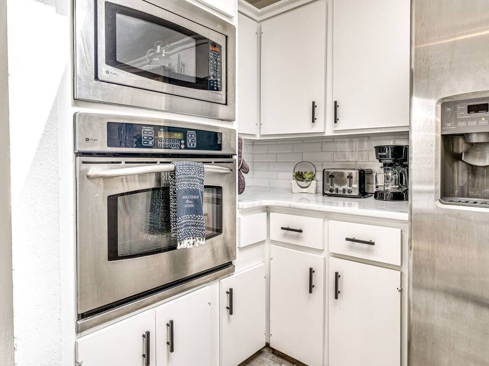 Built-in oven and kitchen storage in a Brookhaven Norman OK short-term rental — functional layout for longer stays.