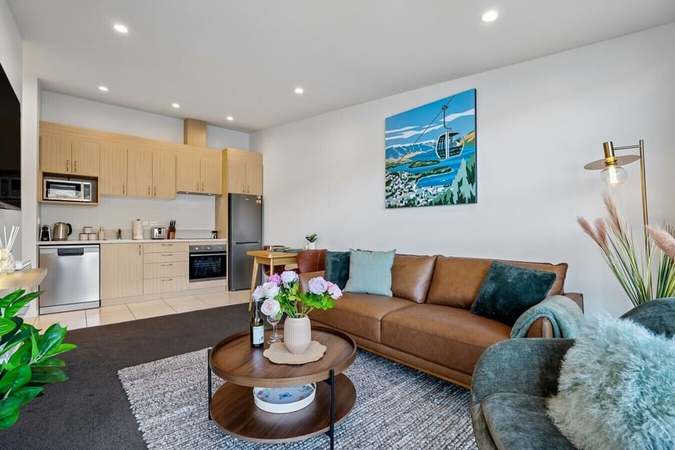 A fully equipped chef’s kitchen with premium appliances, Nespresso coffee, and breathtaking lake views to enjoy while preparing your favourite meals.