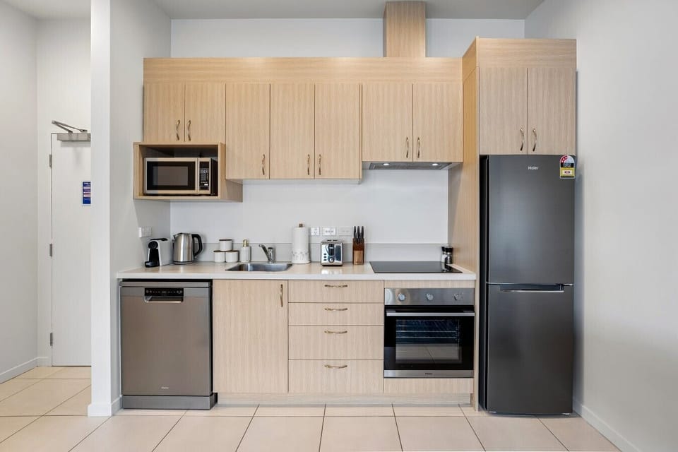 A fully equipped chef’s kitchen with premium appliances, Nespresso coffee, and breathtaking lake views to enjoy while preparing your favourite meals.
