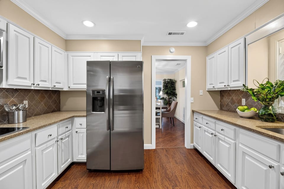 Bright kitchen with ample storage and workspace.