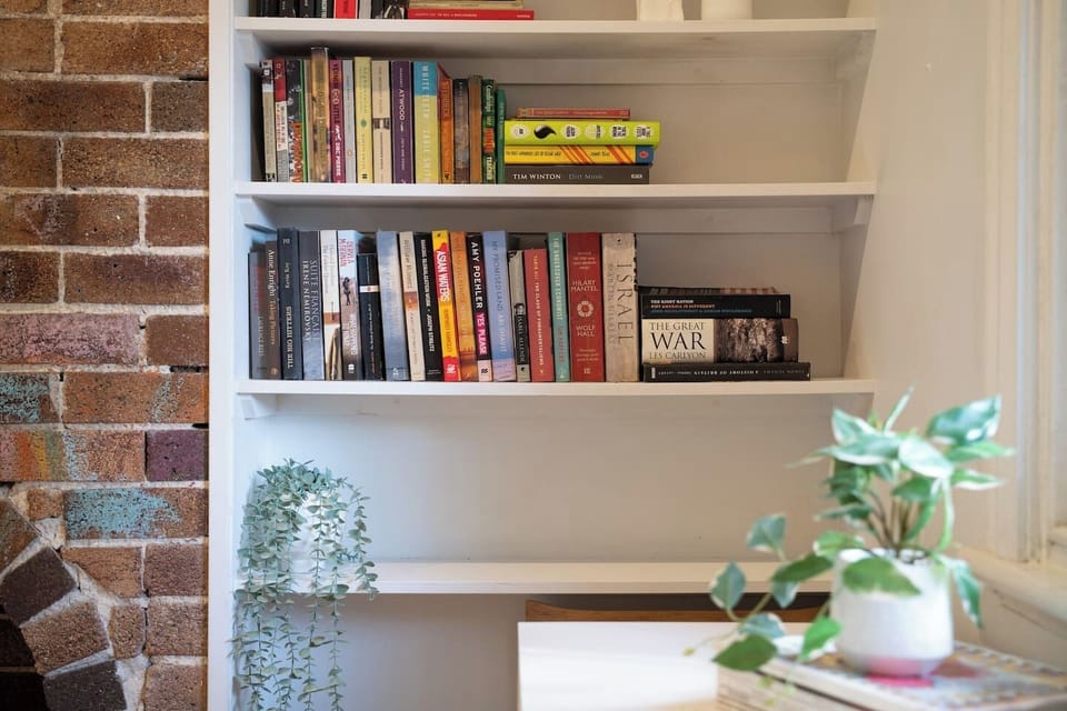 Built-in bookshelves add character and provide a quiet selection for relaxed evenings indoors.