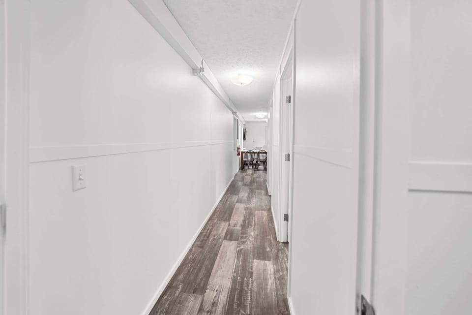 Follow the hall to cozy bedrooms and inviting spaces