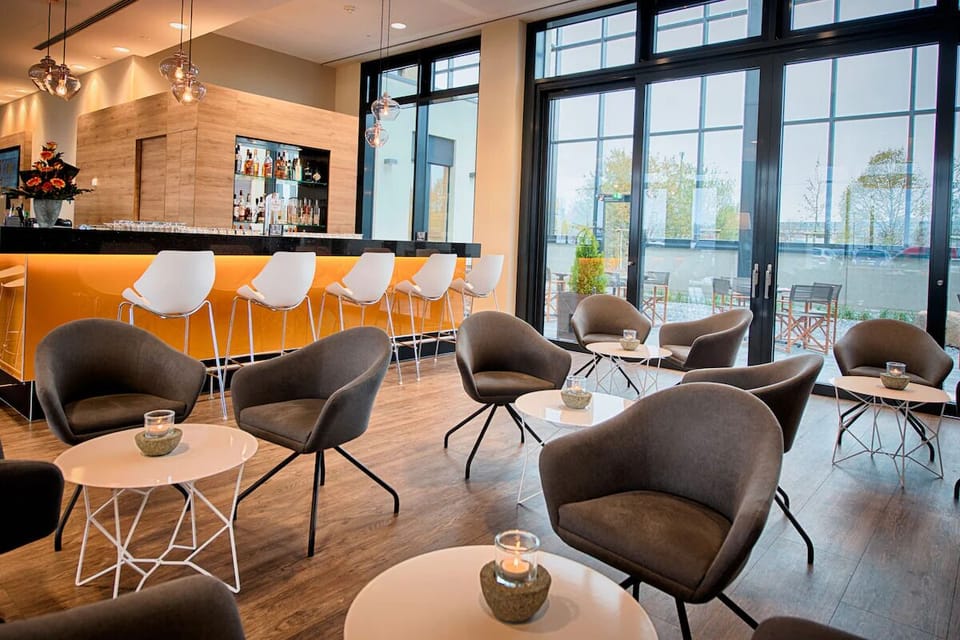 Linger longer with cozy seating and garden views through glass.