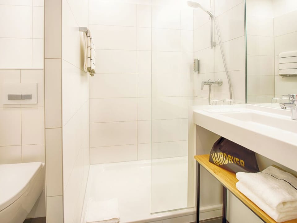 Refresh effortlessly in the bright, spotless walk-in shower.