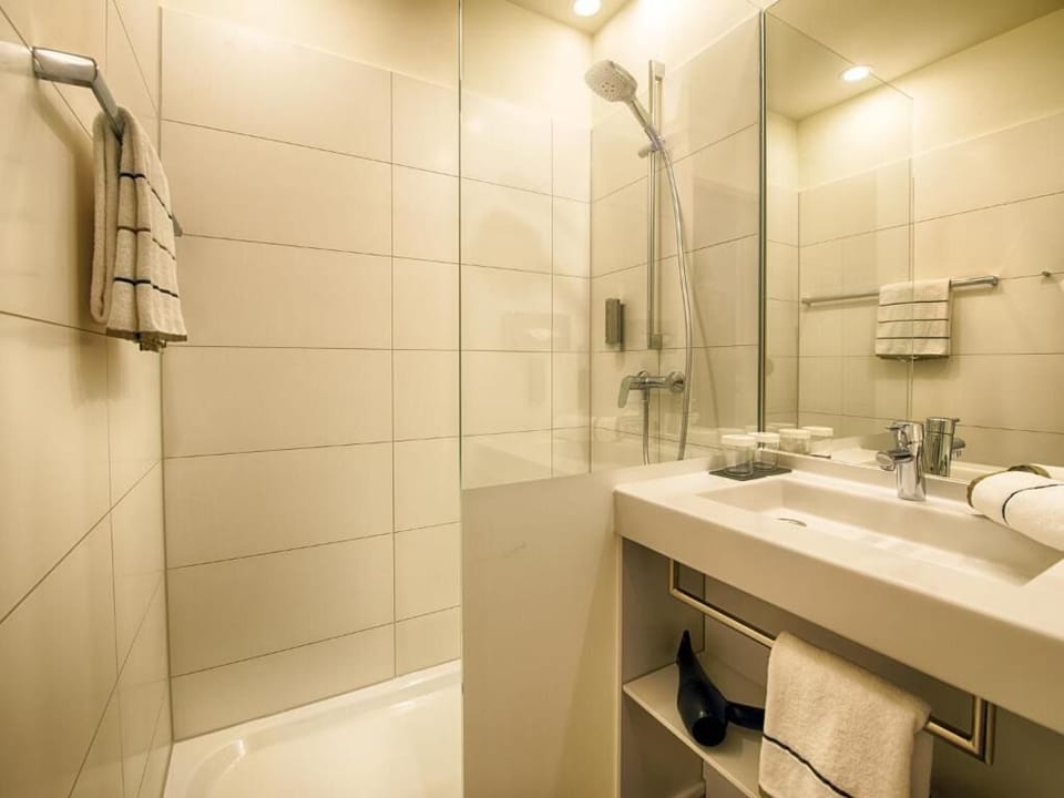 Start your morning with bright lighting and a spacious vanity.
