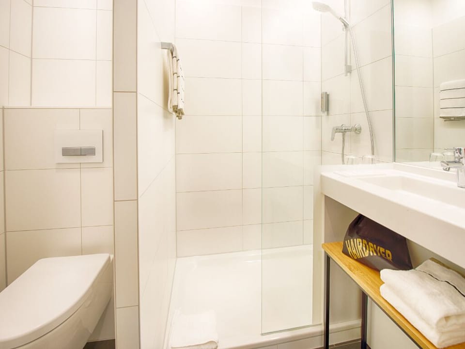 Rejuvenate with a quick rinse in the glass shower.