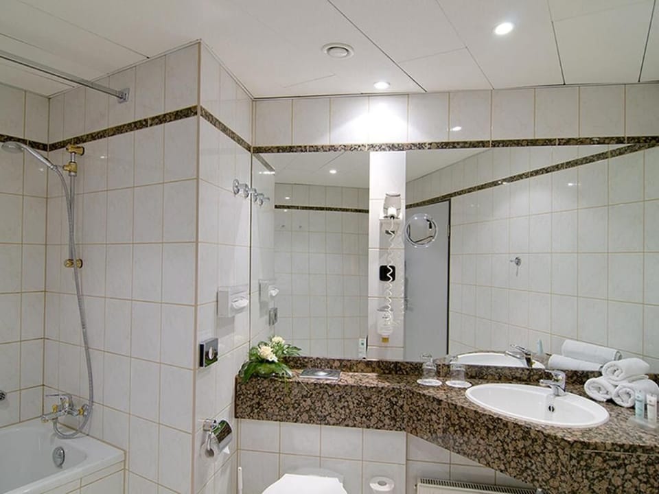 Refresh at the polished vanity with bright, even lighting.
