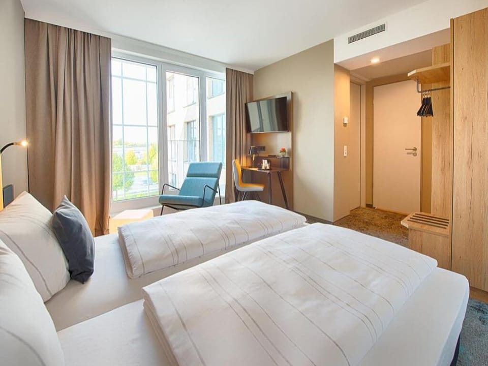 Soak in the view from bed beside oversized, light-filled windows.